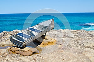 ` Les st Hill and tin Canoe ` is a sculptural artwork by John Blay, Amanda Stuart & Jane Ulman at the Sculpture by the Sea.